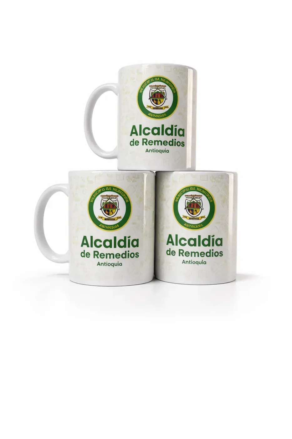 Tres mugs personalizados con escudo institucional impresos para una entidad en Colombia